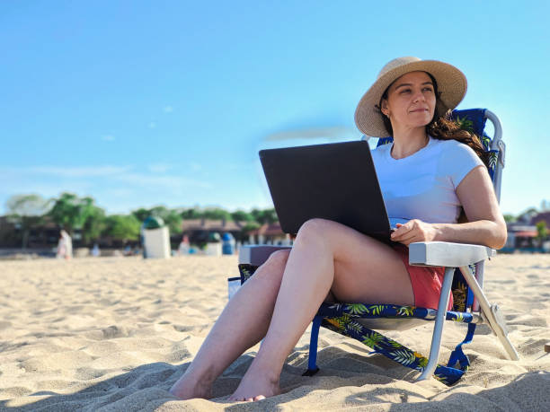 istock woman working on the beach 1403190169