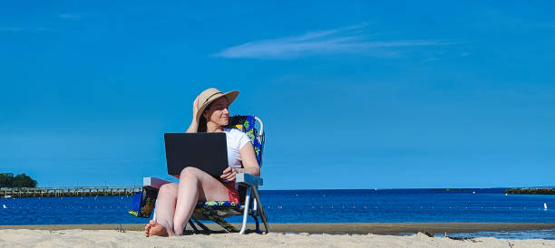 istock woman working on the beach 1403190211
