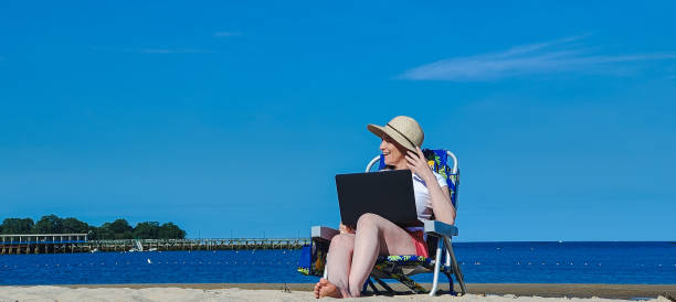 istock woman working on the beach 1403190218