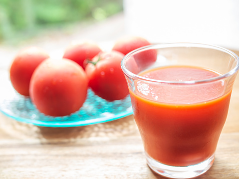 Fresh tomato juice with fresh raw tomatoes