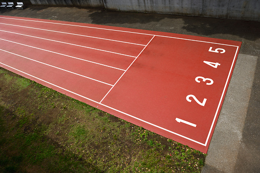 High angle view of an athletics track number.
