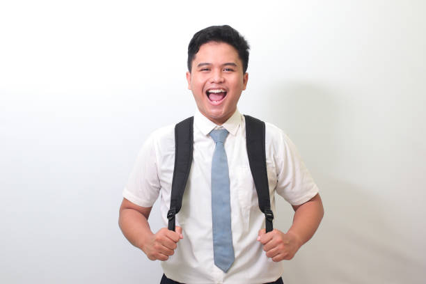 istock Indonesian senior high school student smiling and looking at camera 1403198557
