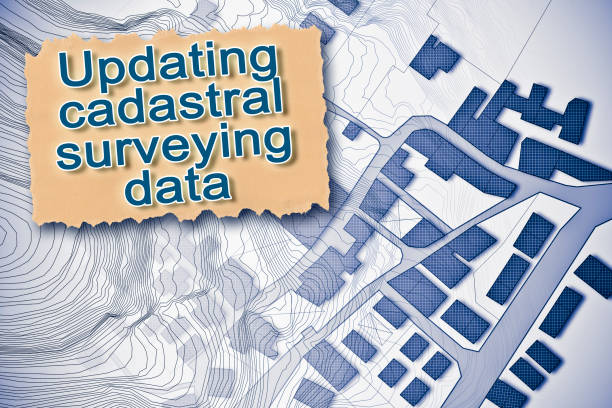 istock Updating public cadastral digital databases and information about land registry - concept with an imaginary cadastral map of territory with buildings and land parcel 1403198895