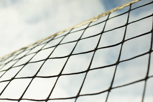 istock Sports net. Volleyball equipment. Grid against sky. 1403199536