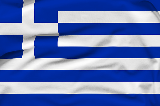 Greece national flag, folds and hard shadows on the canvas.