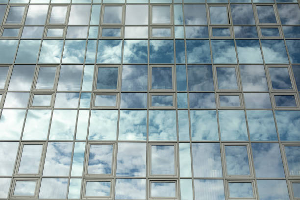 istock Building is made of glass. Mirror surface in office building. 1403199992