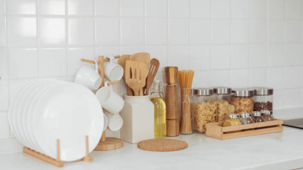 istock Kitchen accessories, kitchen wood utensils in white kitchen room, ss 1403201179