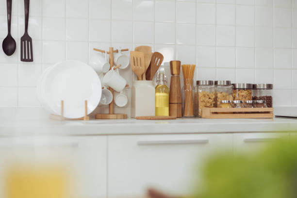 istock Kitchen accessories, kitchen wood utensils in white kitchen room, ss 1403201183