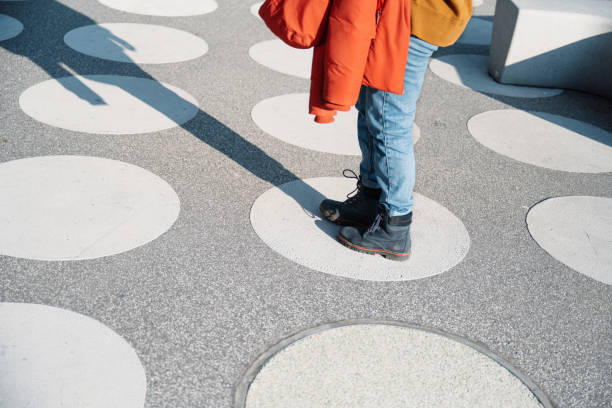 istock young  woman standing on white circle at spotted town square 1403203636