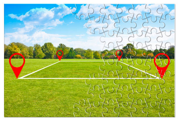 istock Land plot management - real estate concept with a vacant land on a green field available for building construction and housing subdivision in a residential area - puzzle shape concept 1403203727