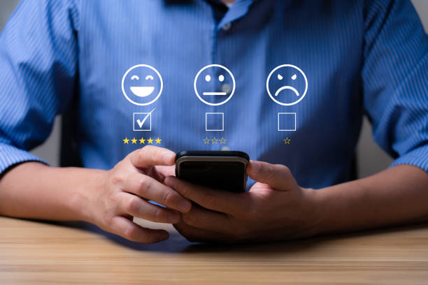 istock Customer satisfaction concept. Hands of a business man using a smartphone to comment 5 stars. Excellent business rating experience. Satisfaction Rating, good and impressive 1403208559