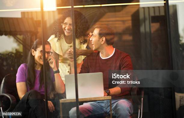 Business People Having Fun While Using Laptop Stock Photo - Download Image Now - India, Office, Indian Ethnicity