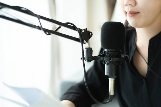 istock Asian young beautiful woman making a podcast live steaming. 1403209770