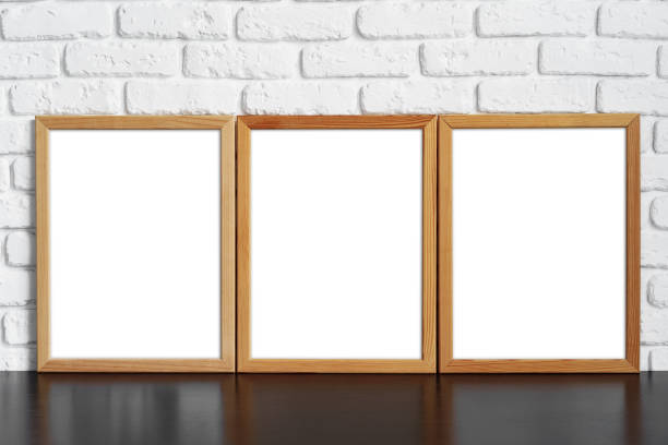 istock Blank picture frame against brick wall with copy space 1403210960