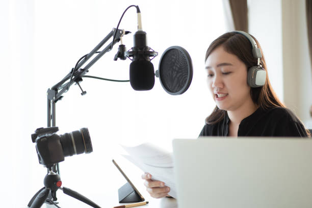 istock Asian young beautiful woman making a podcast live steaming. 1403210995