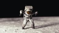 istock Astronaut dancing on the lunar surface. 1403211228