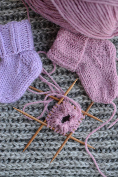 istock Small newborn socks, made of soft alpaca wool yarn 1403215123