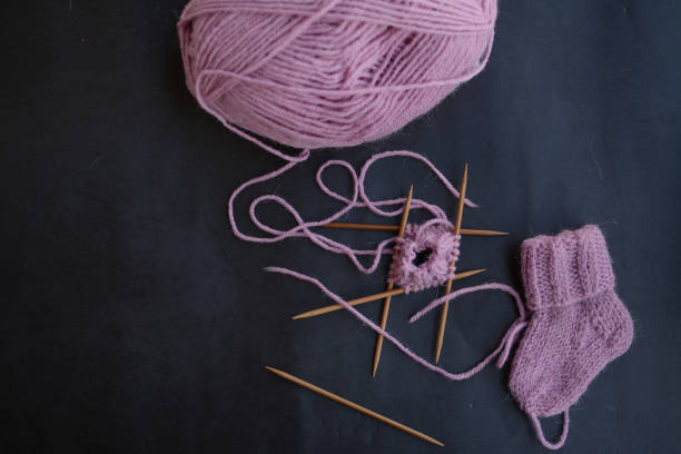 istock Small newborn socks, made of soft alpaca wool yarn 1403215524