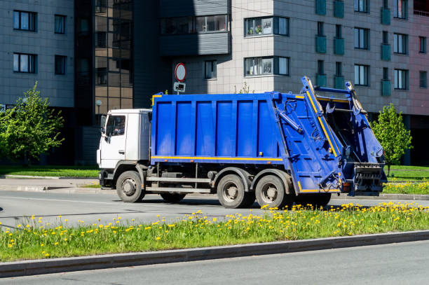 blue-garbage-truck-on-the-street-of-the-city.jpg?s=612x612&w=0&k=20&c=rVa0vvrL9cZyJ5IZsUBSVNxnvd51gU7bxukVzF6y0SE=