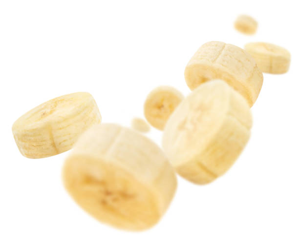 istock Flying banana slices on white 1403221335