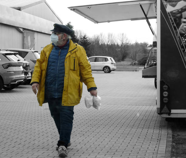 istock Shopping for fish and chips with protective mask 1403223245