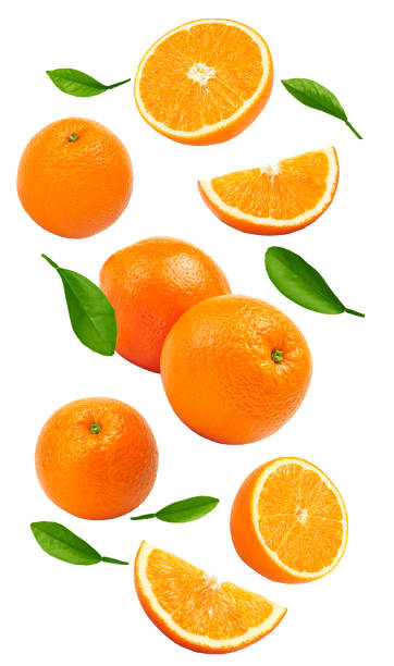 istock flying orange fruits isolated on white background. clipping path 1403223247
