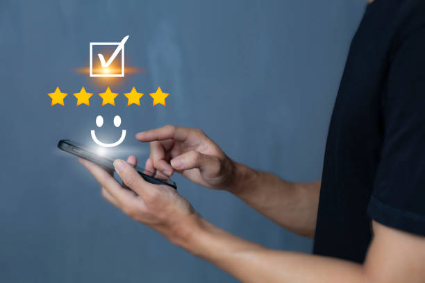 istock Satisfaction and customer service survey concept, business people using  smartphone. to answer the questionnaire And the satisfaction rating, the satisfaction rating with the smiley face icon 5 stars. 1403226611