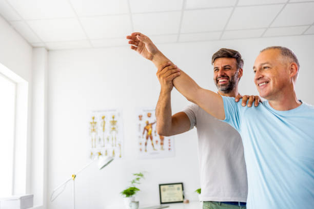 istock Doctor is diagnosing a patient's shoulder and elbow pain 1403226768