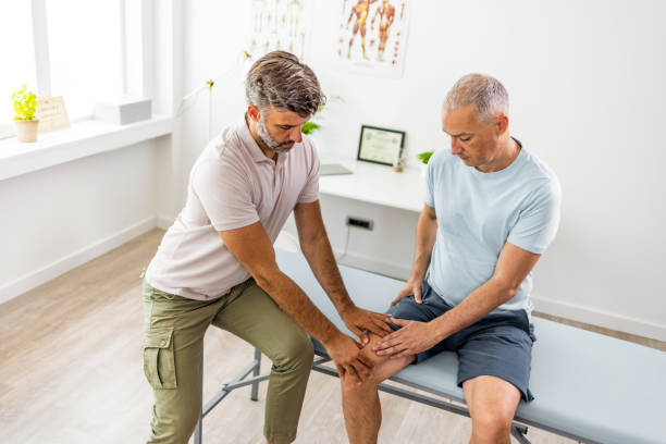 istock Having his knee examined at doctor's office 1403226787