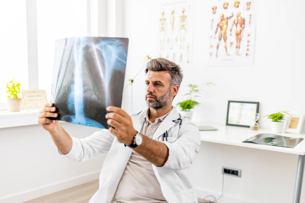 istock Doctor analyzing an x-ray image of a COVID-19 patient 1403226828