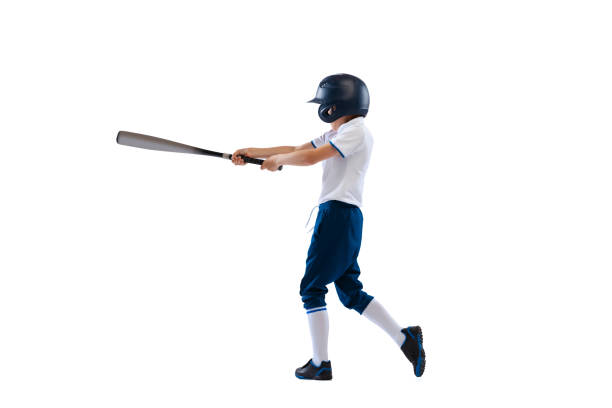 istock Little beginner baseball player in sports uniform playing baseball isolated on white background. Concept of sport, achievements, competition 1403231031