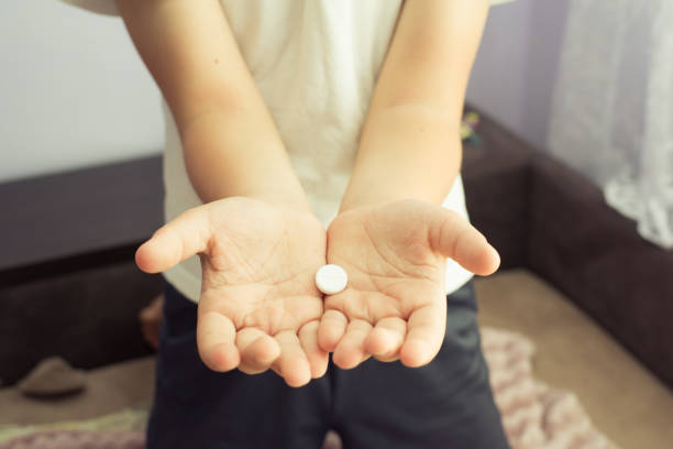 istock the child receives a pill 1403231270