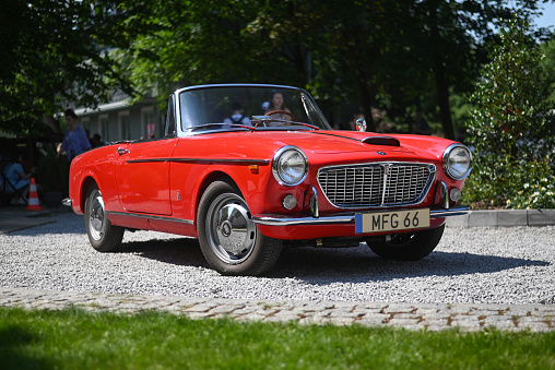 Rozalin, Poland - 12 June, 2022: Fiat 1600 S Cabriolet parked on a street during the open meeting of Italian vehicles friends. This vehicle is one of the rarest convertible vehicles from 60s.