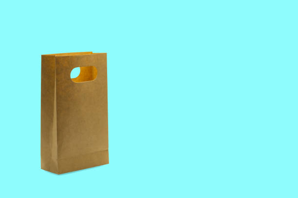 istock Brown paper craft bag isolated. 1403240946