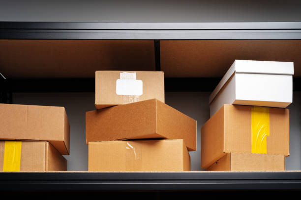 istock Rows of shelves with cardboard boxes in modern warehouse 1403249368