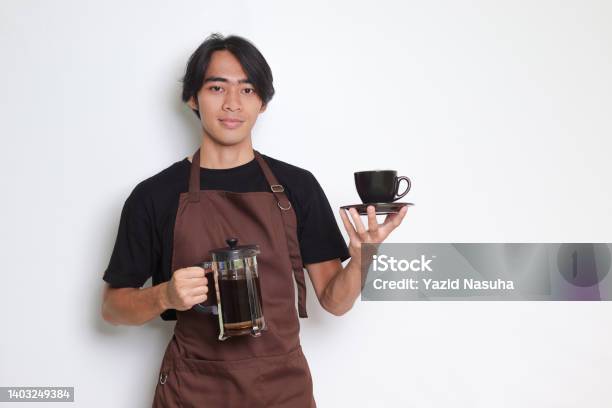 Asian Barista Man Showing A Cup While Holding French Press Coffee Maker Stock Photo - Download Image Now