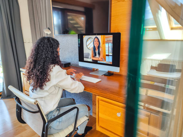 istock Content Hispanic Businesswoman Making A Video Call On A Computer From Home 1403250484