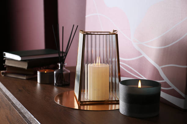 istock Burning scented candles on wooden table indoors 1403251224