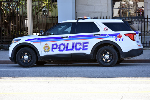 Building Exterior, Packed Canadian Police Land Vehicle Scene In Ottawa Ontario Canada North America