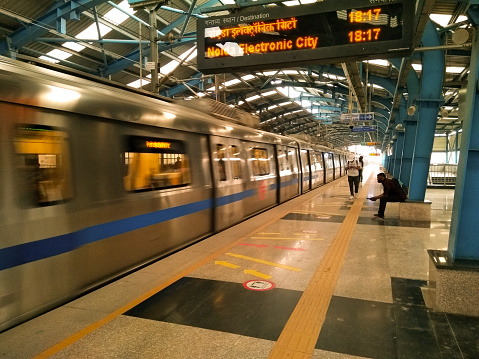 Delhi, India - October 15, 2012: passengers alighting metro train in Delhi, India. Nearly 1 million passengers use the metro daily.