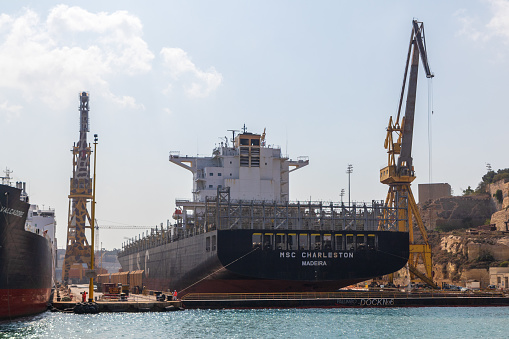 Valletta, Malta - Sep 28, 2021: Huge MSC Charleston vessel from Madeira undergoes maintenance at Malta shipyard