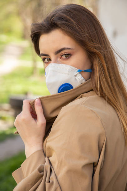 istock woman with mask 1403254062