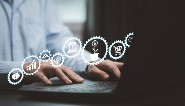 istock Businessman using computer with graph and chart with invest icon such piggy coin , gold bar dollar exchange and real estate for find the best opportunity high benefit from investment concept. 1403256574