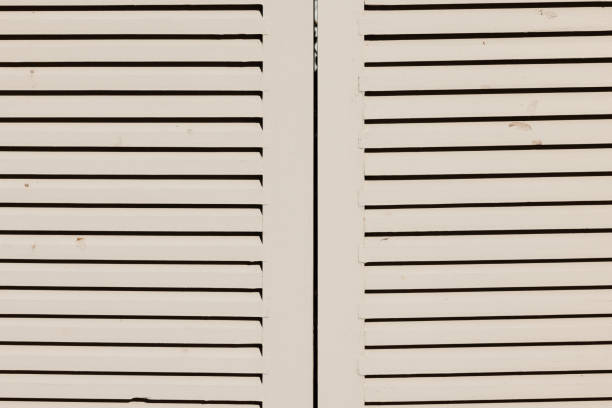 Cream colored wooden window shutters