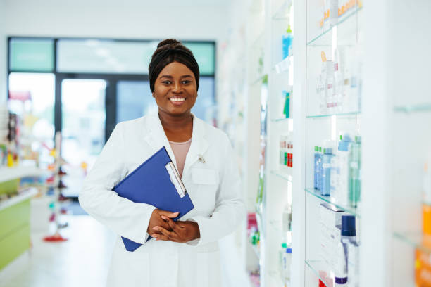 istock African american pharmacist with clipboard posing in pharmacy 1403257996