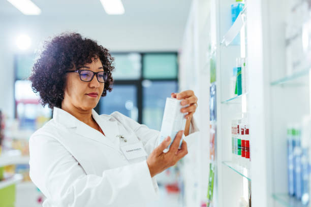 istock Pharmacist reading table of contents on medication 1403258079