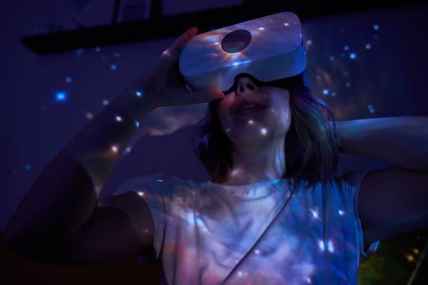 istock Woman is using virtual reality headset. Elements of this image furnished by NASA. 1403258105