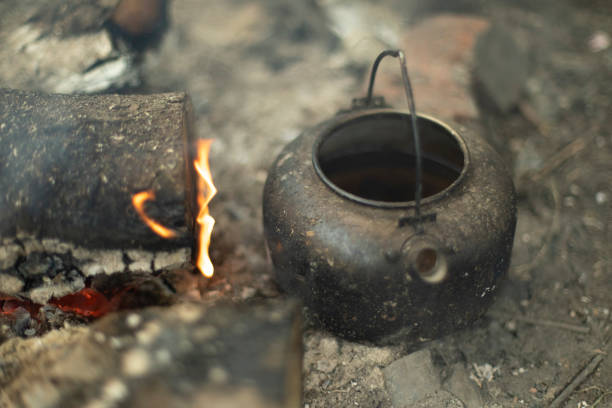 istock Kettle for tea on fire. Tea in nature. 1403261230