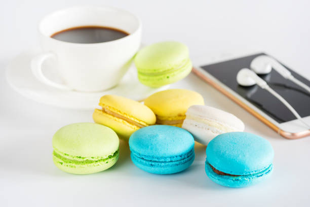 istock Cup of Coffee Colored Macaroon Smartphone on White Background Horizontal LifeStile Background 1403263425