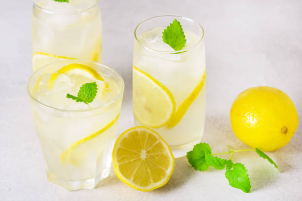 istock Natural Lemonade with Mint and Fresh Citrus on Light Gray Background Summer Refreshing Drink Horizontal 1403264681